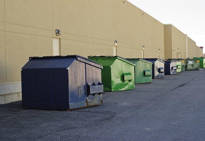 a row of construction dumpsters parked on a jobsite in Clintondale, NY